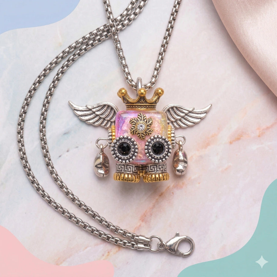 A cute pink steampunk robot pendant with silver wings and a gold crown.